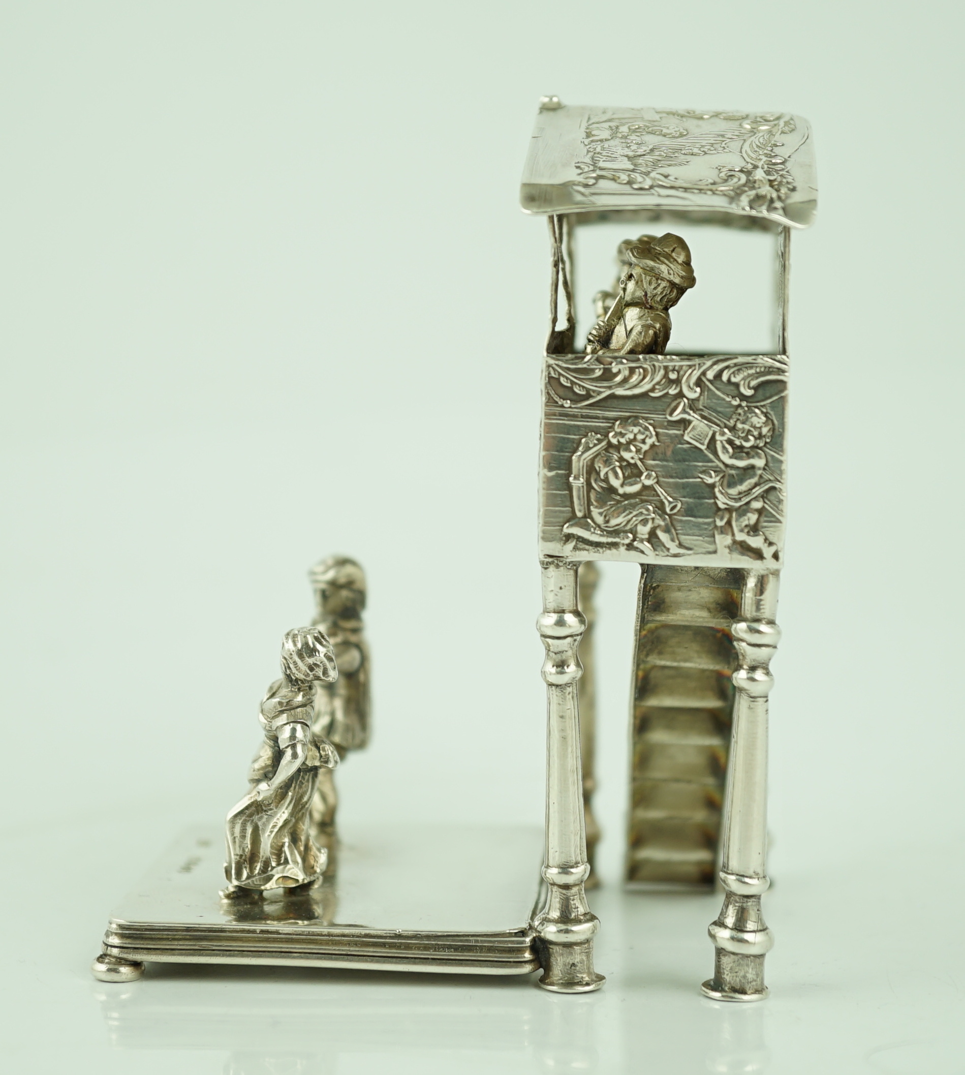 A late 19th century German silver miniature figural group, modelled as two dancers, with three musicians in a band stand, import marks for John George Smith